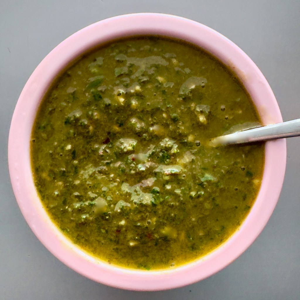 A green sauce made with garlic, parsley and oregano