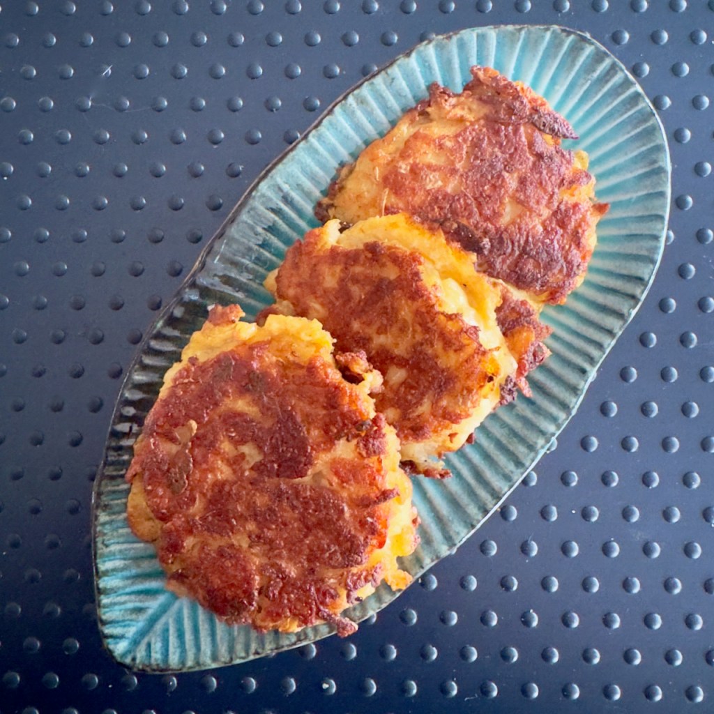 three potato halloumi rostis on a plate